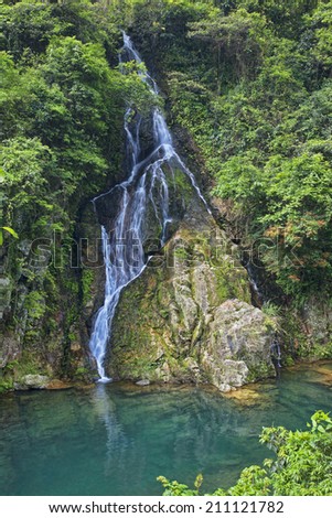 Beautiful seasonal waterfall cascading down the mountainside in the countryside outside of Guilin China
