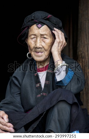 A beautiful 96 year old woman from the Hong Yao ethnic group living in the village of Dazhai, part of the Dragon\'s Backbone Rice Terraces, Longji. Guangxi Zhuang Autonomous Region. Guilin, China