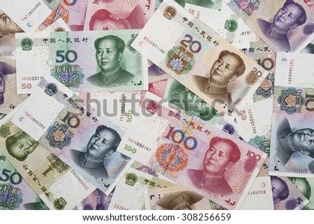 Background collage of Chinese Rmb bank notes  or Yuan with Chairman Mao on the front of each bill