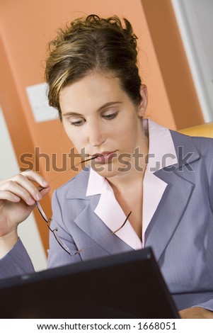Model Release 352  Woman in early 20s working on computer at home