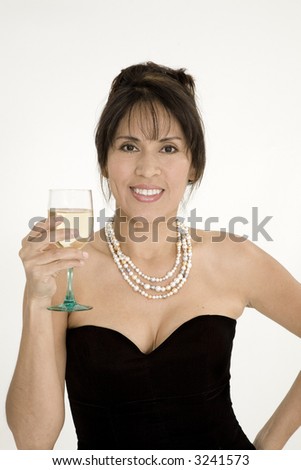 Beautiful Brazilian or Hispanic holding a glass of white wine in a black evening gown on a white background