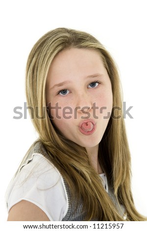 stock photo Caucasian preteen girl displaying some attitude by sticking 