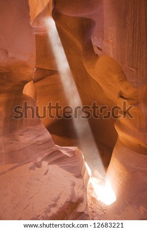 A shaft of light in Lower Antelope Canyon located near Page Arizona on the Navajo reservation. A slot canyon is a narrow canyon, formed by the wear of water rushing through rock.