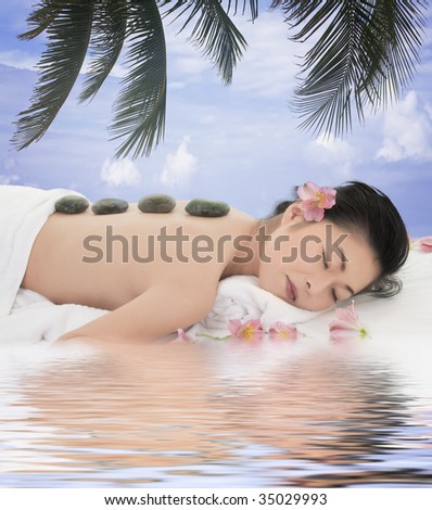 A beautiful and sexy Asian woman being pampered at a spa