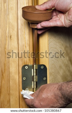 It is good maintenance to oil a door hinge