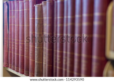 Many books on a shelf in a Library