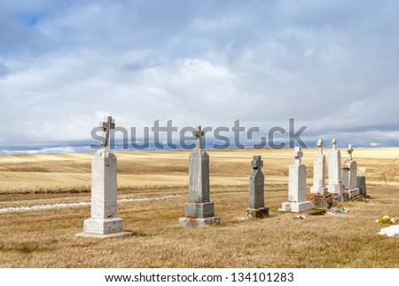 Tomb stones in fields of farm country