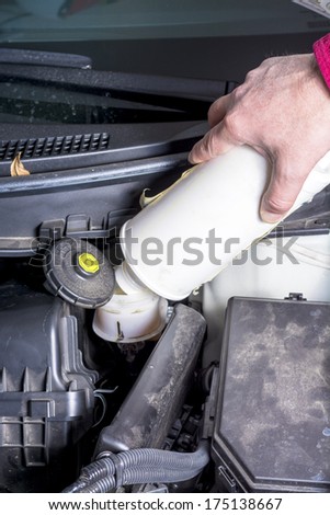 Adding brake fluid to a car