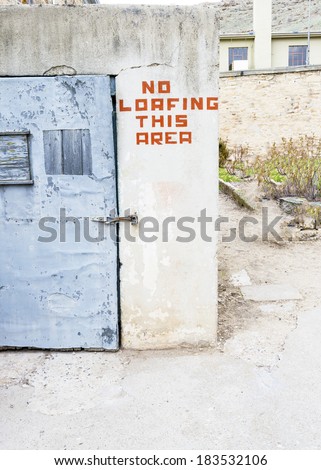 Safety door and warning sign on a wall