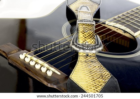 Guitar with strap and sound hole