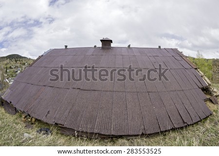 Unique rusted shed roof with rain drops on it