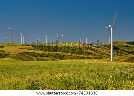 Wind Generators sit atop the hills collecting electricity from the wind