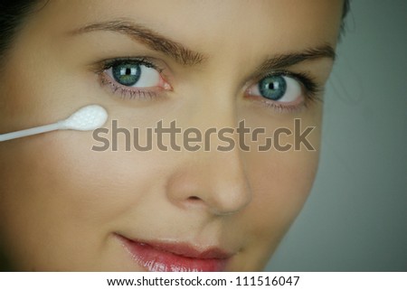 Beautiful woman making face care