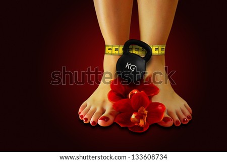 Feet covered with measuring tape and flowers , lose weight