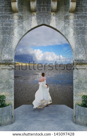 young bride woman runs out of a medieval castle on a beautiful landscape