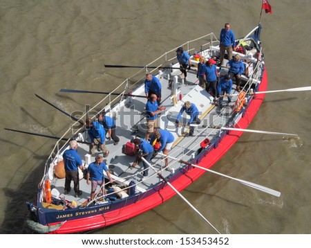 LONDON- SEPT 7: Crews rowing between tower and london bridges, visit london during thames river week, LONDON, SEPT 7, 2013