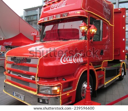 LONDON- DEC 22: The famous coca cola christmas truck, nears the end of its uk tour, with a visit to central london. LONDON, DEC 22, 2014.