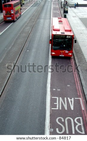 Red london buses, using bus lanes.
