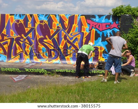 WEST HAM, LONDON, ENGLAND.-SEPT 29: Graffiti artists at work making London walkways desirable on Sept. 29, 2009 in West Ham. London, England.