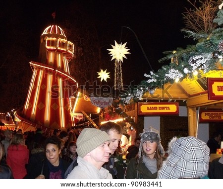 LONDON- DEC 17: Crowds of 1000s enjoy the rides and attractions of the famous Winter wonderland, held yearly at Hyde park, London, dec 17, 2011.