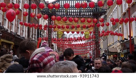 LONDON- JAN 29: Crowds of 1000s celebrate the year of the dragon chinese new year in trafalgar square and chinatown. London, jan 29, 2012.