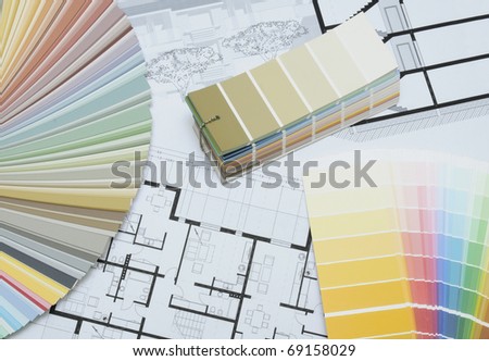 Architect\'s and Designer\'s desk during work. With technical drawing and color sample catalog.