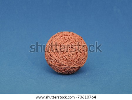 rubber band balls on blue background