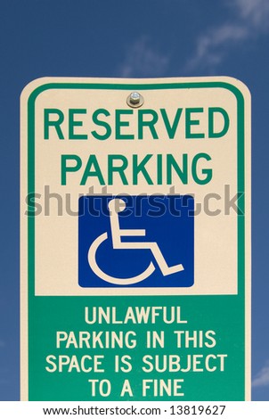 Sign for reserved parking for disabled access, with symbol of wheelchair
