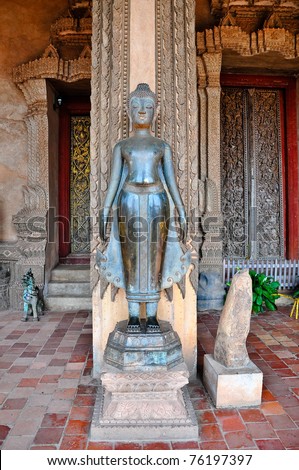 Buddhist statue with hands in the double abhaya mudra position