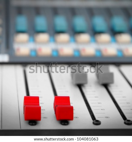 Close up of red audio sound mixer with buttons