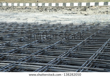An image of metal mesh made with rusty iron rods.