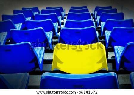 many blue and yellow vip seat in football stadium