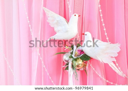 Exotic flowers arrangement over pink and white fabric, flowers background ready for wedding ceremony