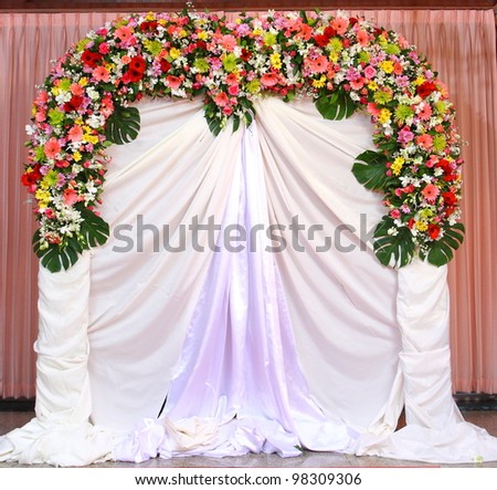 stock photo Beautiful backdrop flowers over white fabric ready for wedding