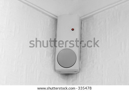A PIR (passive infra red) movement sensor, part of a burglar alarm system