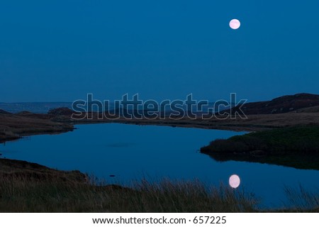 A reflection of the full moon in a Lewis loch