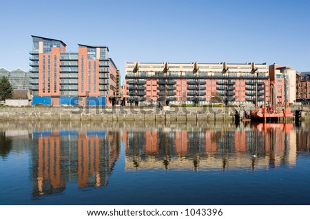 New houses and commercial buildings on the banks of the Clyde in Glasgow, Scotland