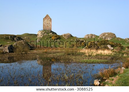 Smailholm Tower, Scottish borders, reflected in the waters of a pool