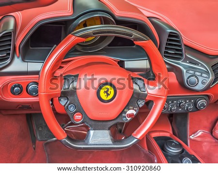 DUBAI - DECEMBER 29, 2014: Ferrari 458 Italia red Italian supercar steering wheel and dashboard