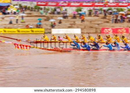 PHITSANULOKE, THAILAND - SEP 21 : Panning technique unidentified crew in traditional Thai long boats competition festival on September 21, 2008, Phitsanuloke, Thailand.