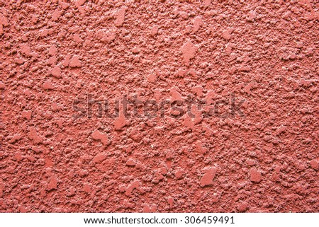 Red concrete wall background.Walls with rough surfaces.