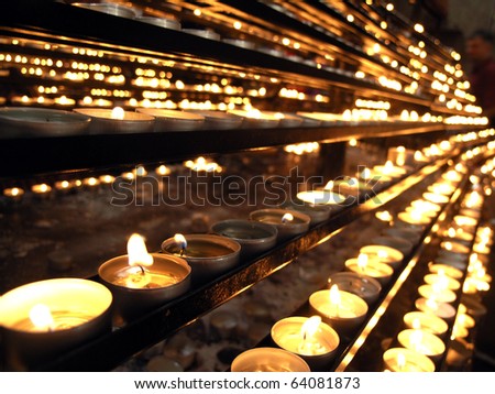 Votive church candles in rows