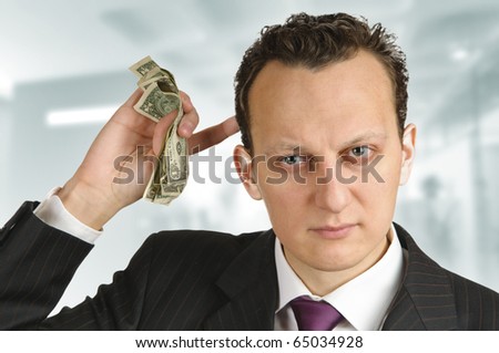 Business man calculating money in his mind