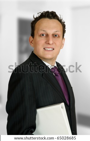 Ecstatic business man holding a business folder