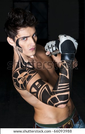 stock photo : Young boxer with tattoo on his shoulder and arm