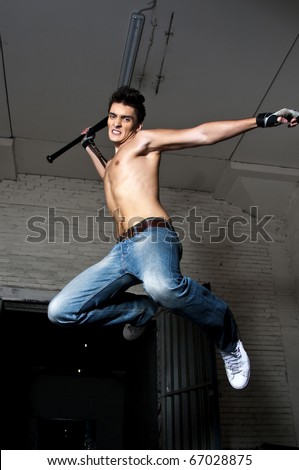 Kick in jump, shot of man on urban background