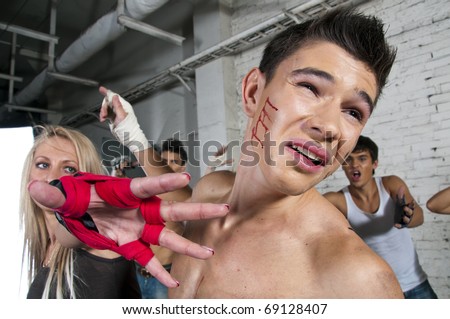 Street fight, woman beating a man, hook capture