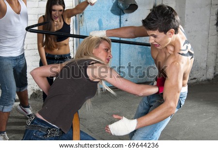 Street fight, woman beating a man, hook capture