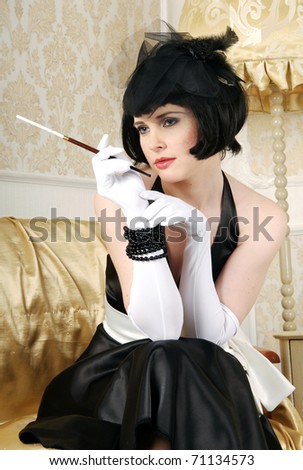 Vogue style vintage portrait. Retro-styled woman sitting with mouthpiece
