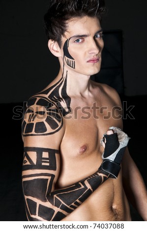 stock photo Young boxer with tattoo on his shoulder and arm